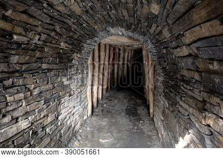 The Entrance To The Historical Flascharuv Dul Slate Mine In Odry, Czech Republic With A Dark Corrido