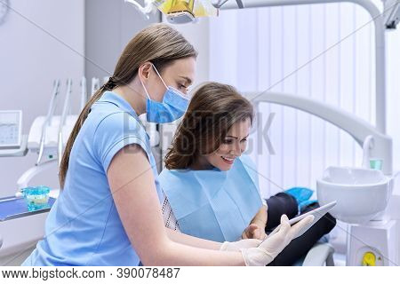 Dentistry, Dental Treatment, Woman Doctor Dentist Consults Patient In Chair, Smile And Talk. Medicin