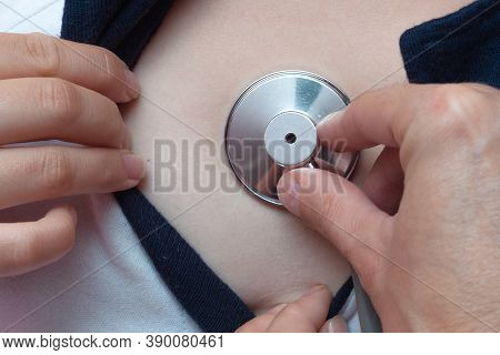 Close Up Doctor Listening To Patient Heart With A Stethoscope, Heart Beat.