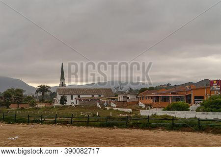 Coquimbo, Chile - December 7, 2008: Early Morning Overcast Brown Cloudscape. White Capilla San Gabri