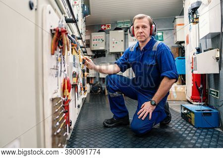 Marine Engineer Officer In Engine Control Room Ecr. He Works In Workshop