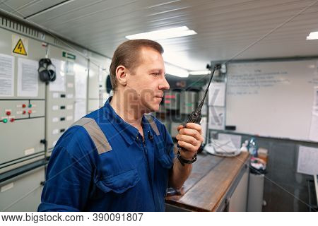 Marine Engineer Working On Radio Communication At Engine Control Room Ecr