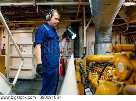 Marine Engineer Officer Controlling Vessel Enginesand Propulsion In Engine Control Room Ecr