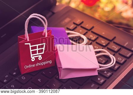 Business Concept Online Shopping, Paper Shopping Bags On Notebook Keyboard. Online Shopping E-commer