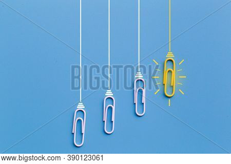 Great Ideas Concept With Paperclip,thinking,creativity,light Bulb On Blue Background,new Ideas Conce