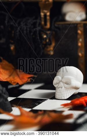 Halloween Party Set Up Props. White And Black Sculls With Jack Olantern Pumpkin. Death Symbol. Fear 