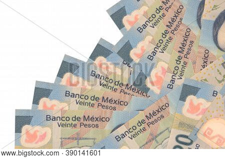 20 Mexican Pesos Bills Lies In Different Order Isolated On White. Local Banking Or Money Making Conc
