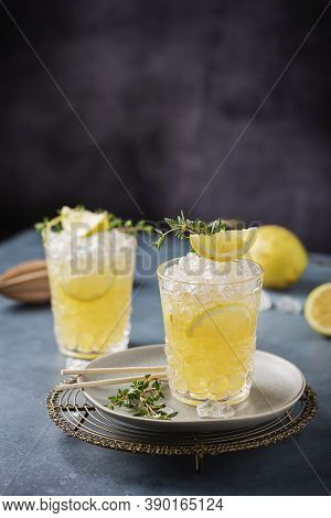 Cocktail With Lemon, Timo And Crushed Ice