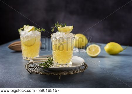 Cocktail With Lemon, Timo And Crushed Ice