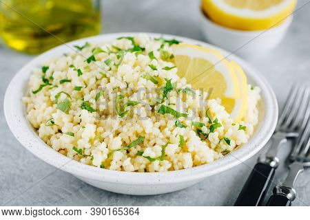 Lemon Herb Couscous In Bowl On Gray Background