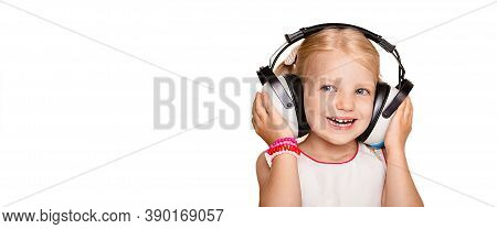 Positive Little Girl Wearing Special Earphones Getting A Hearing Test, Audiometer Hearing Test. Isol