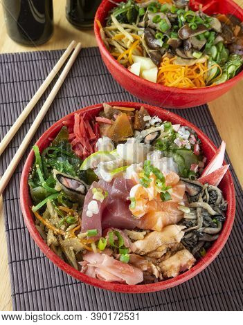 Fish Chirashi, Japonese Food On Bowls With Wooden Hashis.