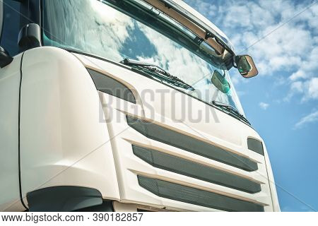 A Big White Truck Cabin View From Underneath Against The Sky