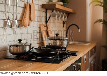 Rustic Kitchen Details. Empty Pans And Pans In The Kitchen Close-up And Copy Space.