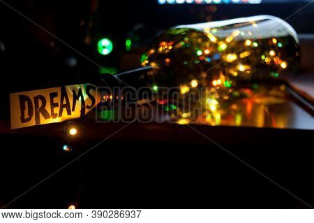 fireworks in a bottle with a dream card on the table for the new year celebration