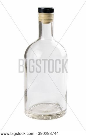 Empty Glass Bottle Isolated On A White Background. Bottle For Alcohol. Clear Bottle. Front View