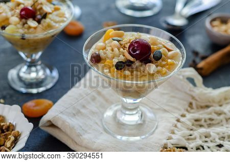 Traditional Turkish Dessert Asure Or Ashura ( Noah Pudding) Making From The Boiled Cereals With Drie