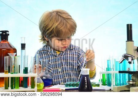 Little Kids Scientist Earning Chemistry In School Lab. What Is Taught In Chemistry. Lab Microscope A