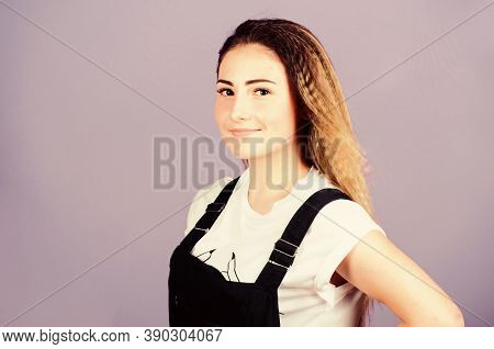 Popular Look. Woman Smiling Face Posing With Stylish Hairstyle On Violet Background. Hair Crimping M