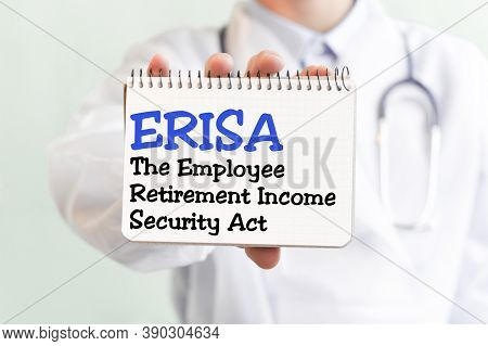 Doctor Holding A Card With Text Erisa. The Text Is Written In Blue Letters In A Medical Journal