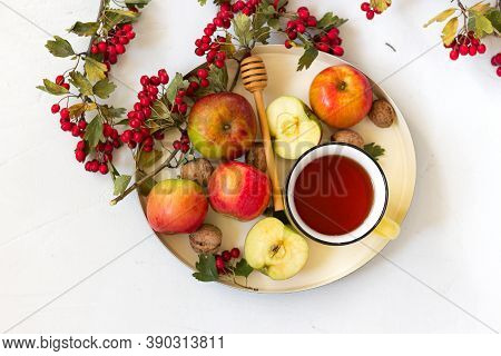Cozy Autumn Hot Tea With Honey, Apples And Red Hawthorn Berries On A Tray. Still Life On White Backg