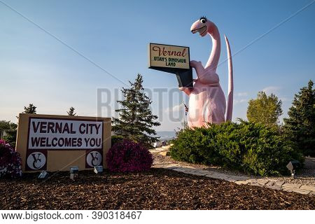 Vernal, Utah - September 24, 2020: Sign For Vernal Utah, With Its Famous Pink Dinosaur Statue, Taken
