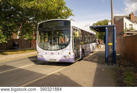 Hexthorpe, Doncaster, England - October 7, 2020. Bus Leaving A Stop In The Hexthorpe Village.