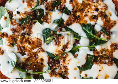 Healthy Plant-based Food Recipes Concept, Vegan Pizza With Cashew Cheese  And Spinach About To Go In
