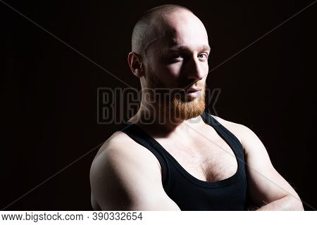 Man Close Up Portrait, With Llong Shadow On Black Background Low Key