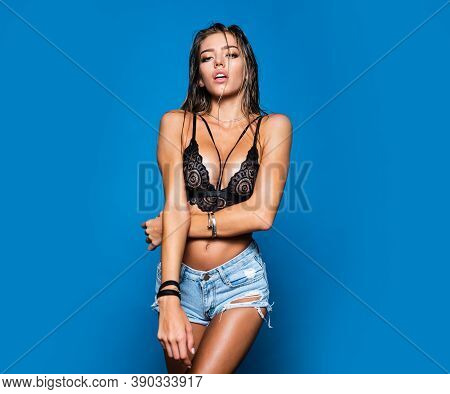 Sensual Girl In The Bra. Young Woman With A Beautiful Body In Sexy Lingerie