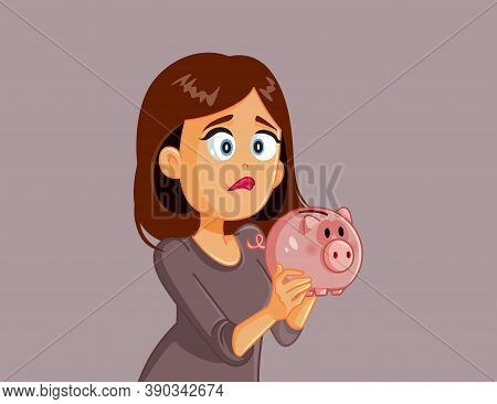Unhappy Broke Woman Holding A Piggy Bank