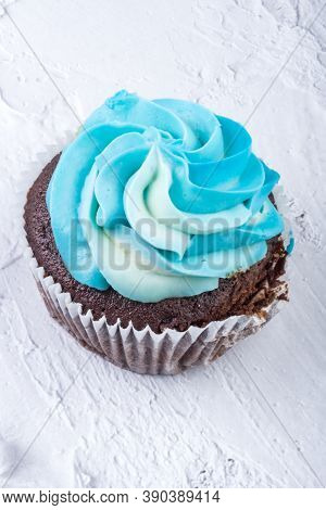 Tasty Cupcake Or Muffin With Blue Cheese Cream Frosting On White Background