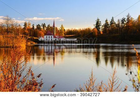 beautiful Priory palace and lake at autumn sunset, Gatchina, Saint-Petersburg, Russia