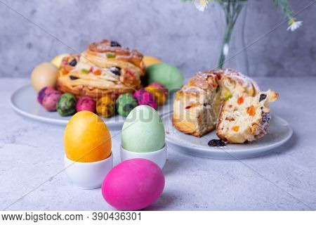 Painted Eggs And Craffin (cruffin) With Raisins, Nuts And Candied Fruits. Easter Bread Kulich. Easte