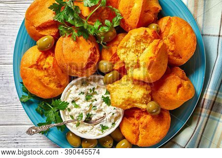 Southern Cuisine: Gluten-free Corn Muffins Of Cornmeal, Yogurt, And Eggs Served On A Blue Plate With