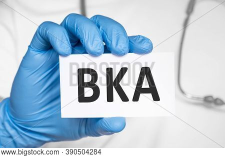 Doctor Holding A Card With Text Bka Below The Knee Amputation., Medical Concept