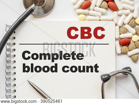 Page In Notebook With Cbc Complete Blood Count. On White Background With Stethoscope And Group Of Pi
