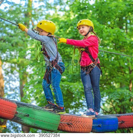Hike And Kids Concept. Child Boy Having Fun At Adventure Park. Climber Child. Climber Child On Train