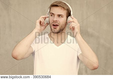What A Pure Sound In Phonics. Handsome Guy Listen To Sound Track. Surprised Man Enjoy Music In Earph
