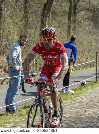 Wallers, France - April 12,2015: The French Cyclist, Cyril Lemoine Of Cofidis Team Riding On A Cobbl