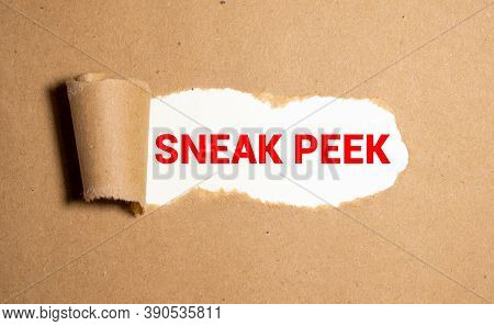 The Phrase Sneak Peek Appearing Behind Torn Brown Paper