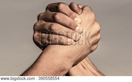 Rivalry Concept. Two Men Arm Wrestling. Arms Wrestling. Friendly Handshake, Friends Greeting, Teamwo
