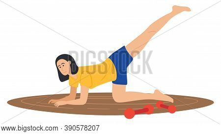 The Girl Goes In For Sports On An Oval Rug At Home, Next To Red Dumbbells. Sport Activity At Home. H