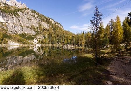Autumn In The Dolomites, View Of Federa Lake Surrounded By Mountains. High Quality Photo