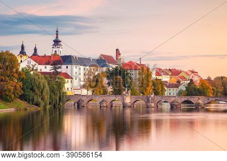 Pisek, Czech Republic. Cityscape Image Of Pisek With Famous Stone Bridge At Beautiful Autumn Sunset.