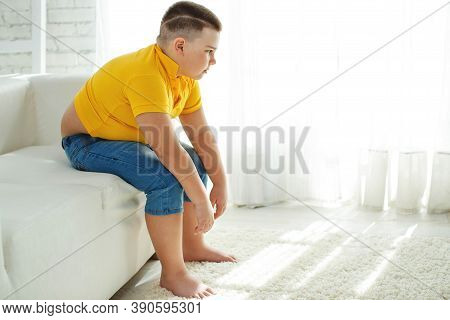 A Boy With Metabolic Disorders. Child With The Problem Of Childhood Obesity. Overweight Obese Fat Bo