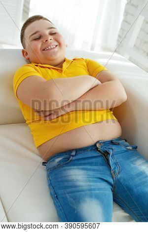 A Boy With Metabolic Disorders. Child With The Problem Of Childhood Obesity. Overweight Obese Fat Bo