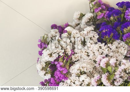 Close Up Picture Of Dried Statice Flowers On Light Background. Caspian Dried Flowers In The Bouquet,