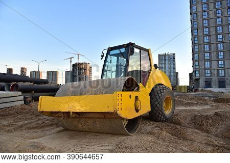 Vibro Roller Soil Compactor Leveling Ground At Construction Site. Vibration Single-cylinder Road Rol