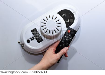 Robot For Cleaning Windows And Tiles With Remote Control. A Device For Cleaning Windows Indoors And 
